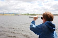 Young Women Looking Through Telescope Royalty Free Stock Photography Young Women Looking Through Telescope Royalty Free Stock Photography
