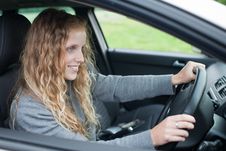 Pretty Young Woman Driving Her  Car Royalty Free Stock Image