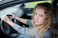 Pretty Young Woman Driving Her  Car Royalty Free Stock Photos