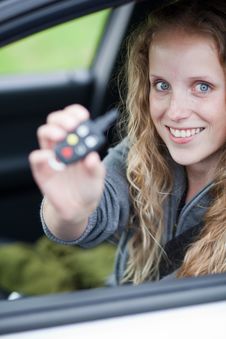 Pretty Young Woman Showing Off Her Brand Car Royalty Free Stock Photography