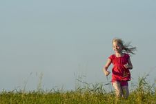 Little Girl Runs On Meadow In Summer Stock Image