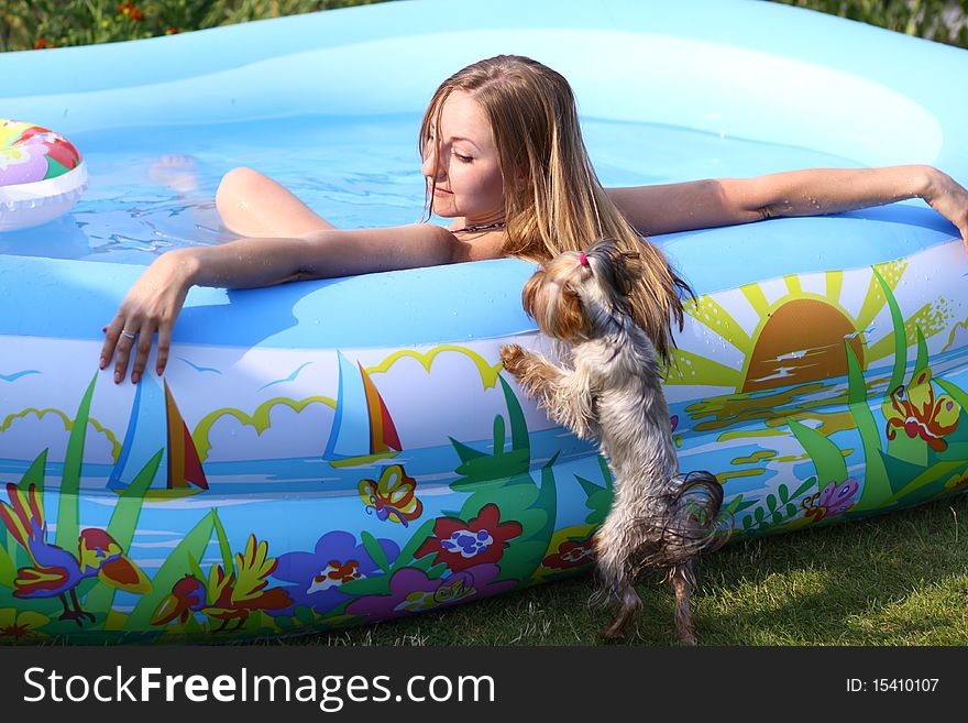 Portrait of a beautiful happy woman in swimming pool