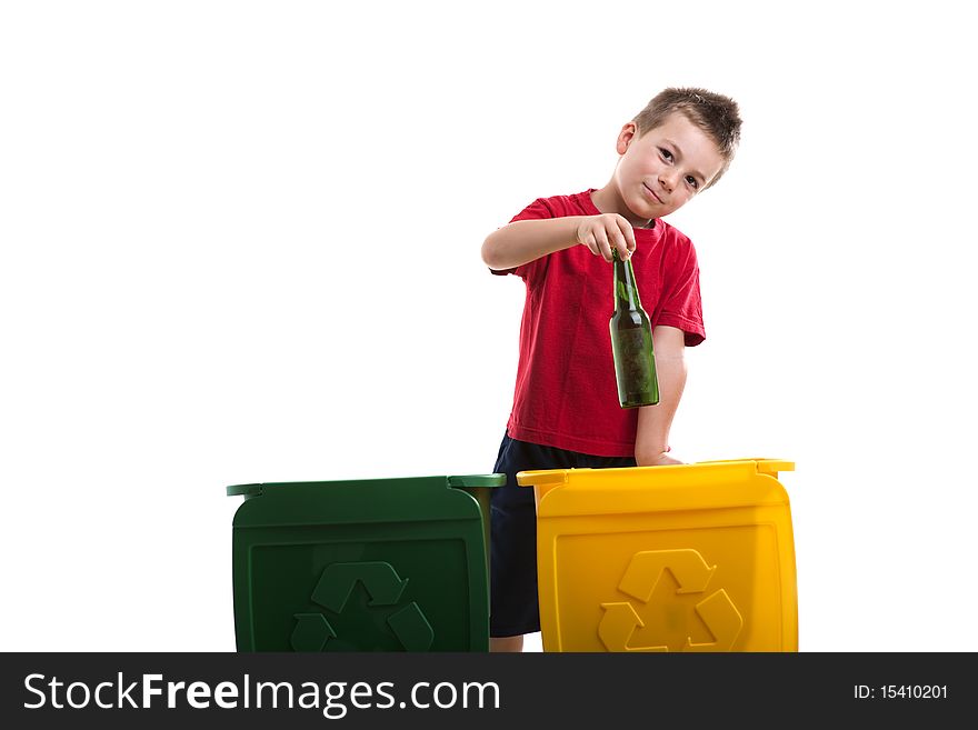 Little boy throwing botlles into recycling bin. Little boy throwing botlles into recycling bin