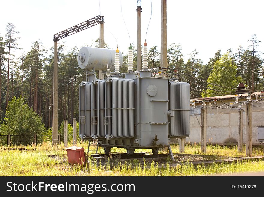 The powerful high-voltage transformer on city substation. The powerful high-voltage transformer on city substation