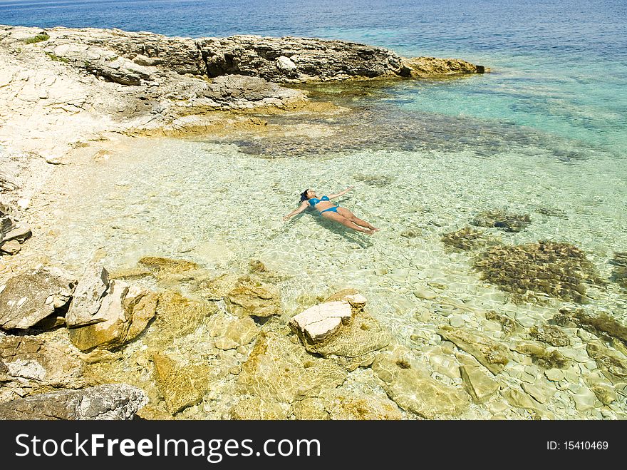 Woman Relaxing In Sea