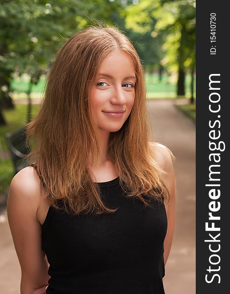 Beautiful young woman in a park