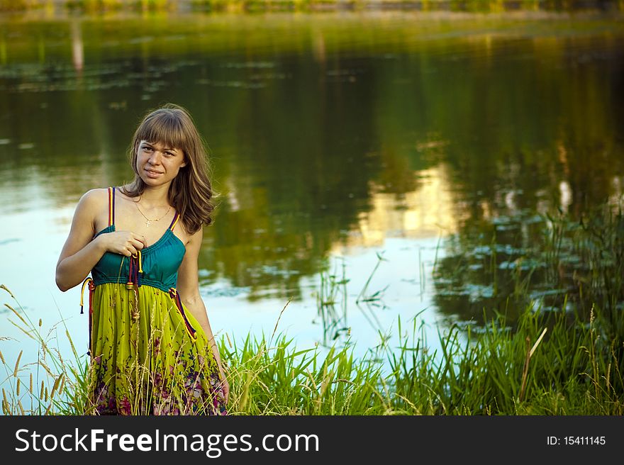 An attractive young woman walking on the lake. An attractive young woman walking on the lake