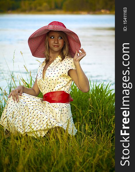 Retro girl resting at the lake. Retro girl resting at the lake