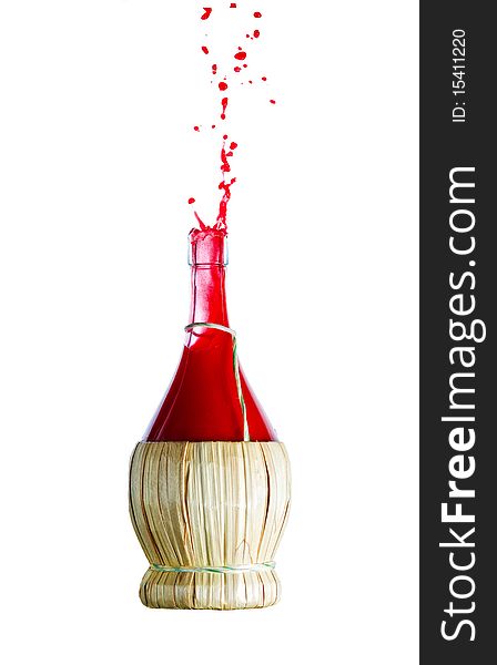 Vintage straw wrapped Bottle and creative splashing red liquid. Isolated on white. Vintage straw wrapped Bottle and creative splashing red liquid. Isolated on white