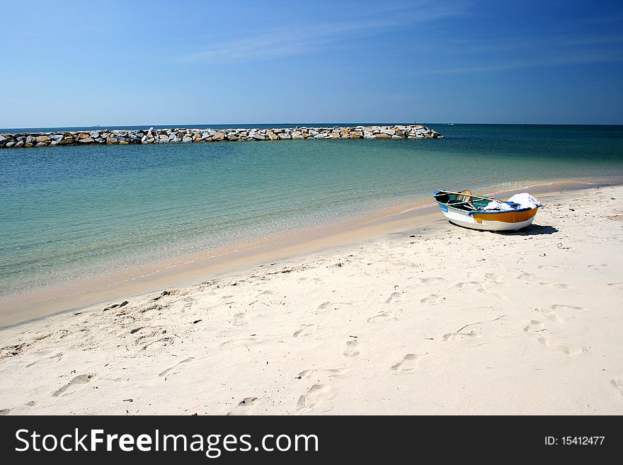 A boat on the beauty and peaceful beach in Thailand. A boat on the beauty and peaceful beach in Thailand