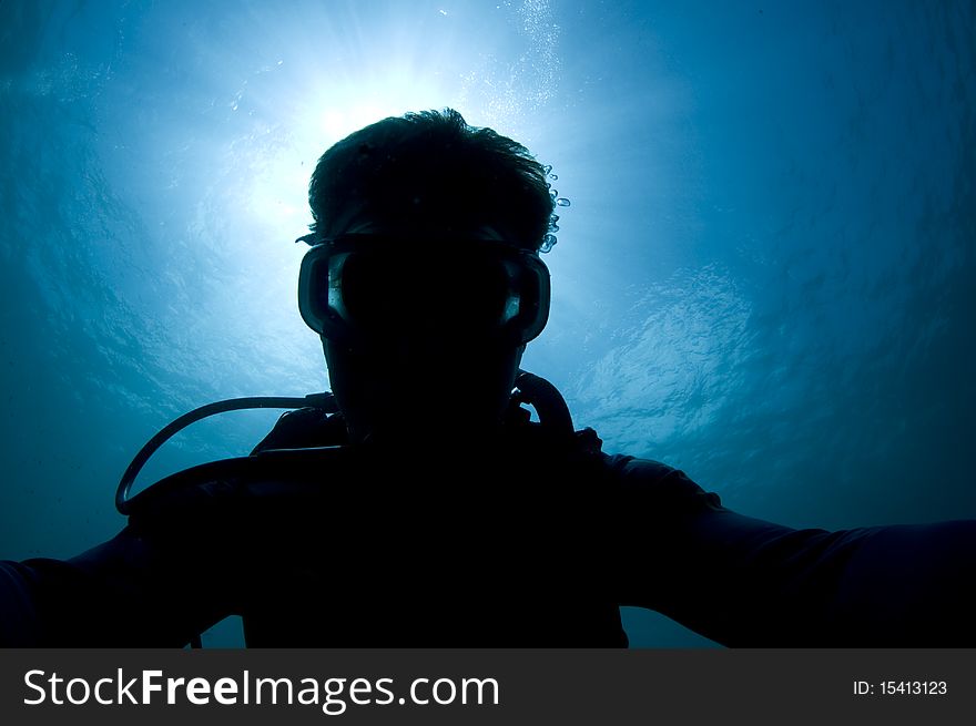 Silhouette of a diver in the Caribbean Sea