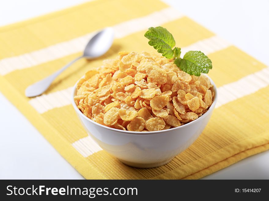 Bowl of crunchy corn flakes - closeup