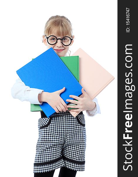 Shot of a little girl in glasses standing with books. Isolated over white background. Shot of a little girl in glasses standing with books. Isolated over white background.