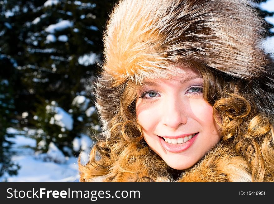 Portrait of young smiling woman in fur cap. Portrait of young smiling woman in fur cap