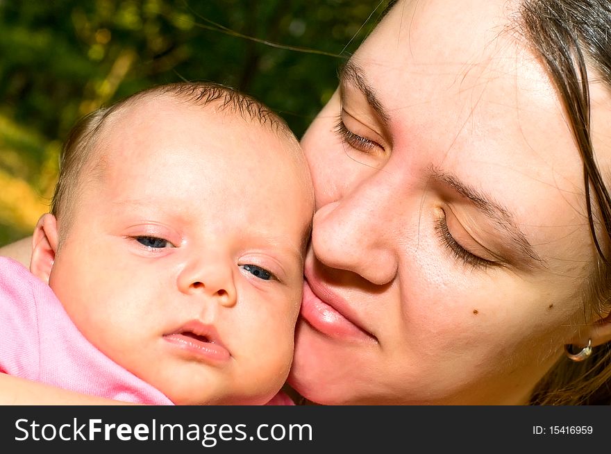 Close-up portrait of mother with child. Close-up portrait of mother with child