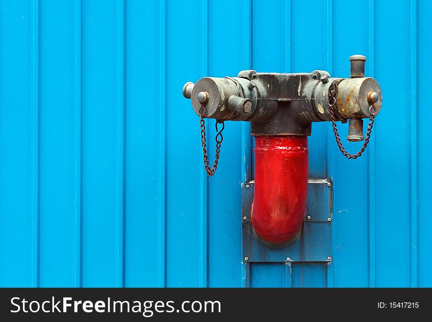 Red Fire Hydrants be side Blue Building