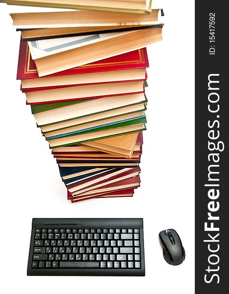 Black keyboard and mouse near books. Isolated on white. Black keyboard and mouse near books. Isolated on white