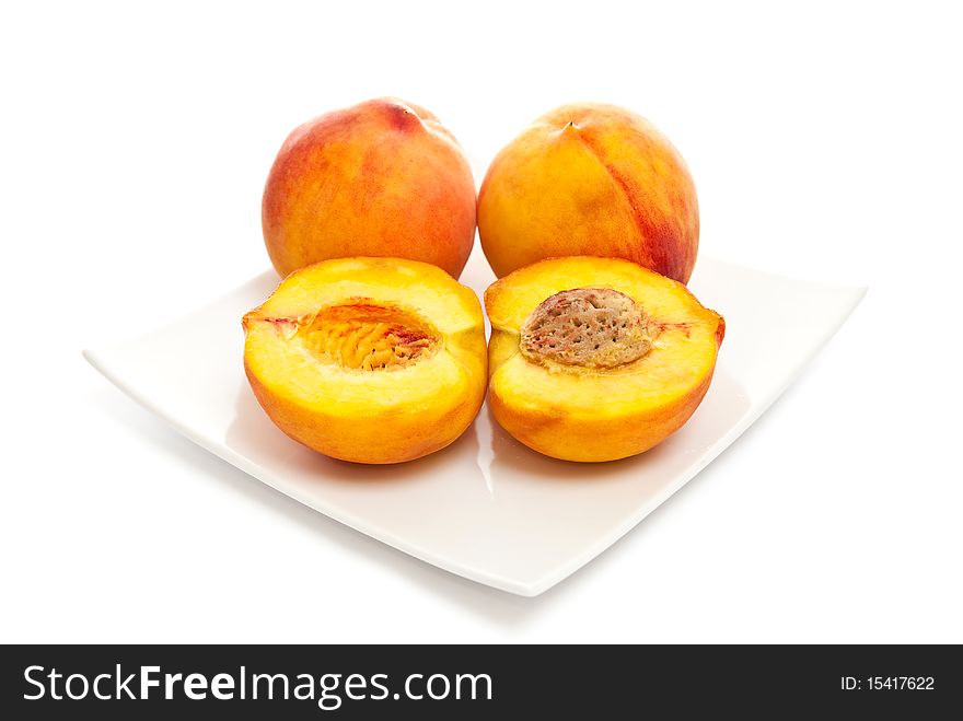 Three peaches on a white background. Three peaches on a white background.