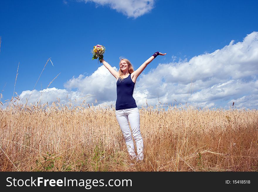 Young happy woman with a bouquet. Young happy woman with a bouquet