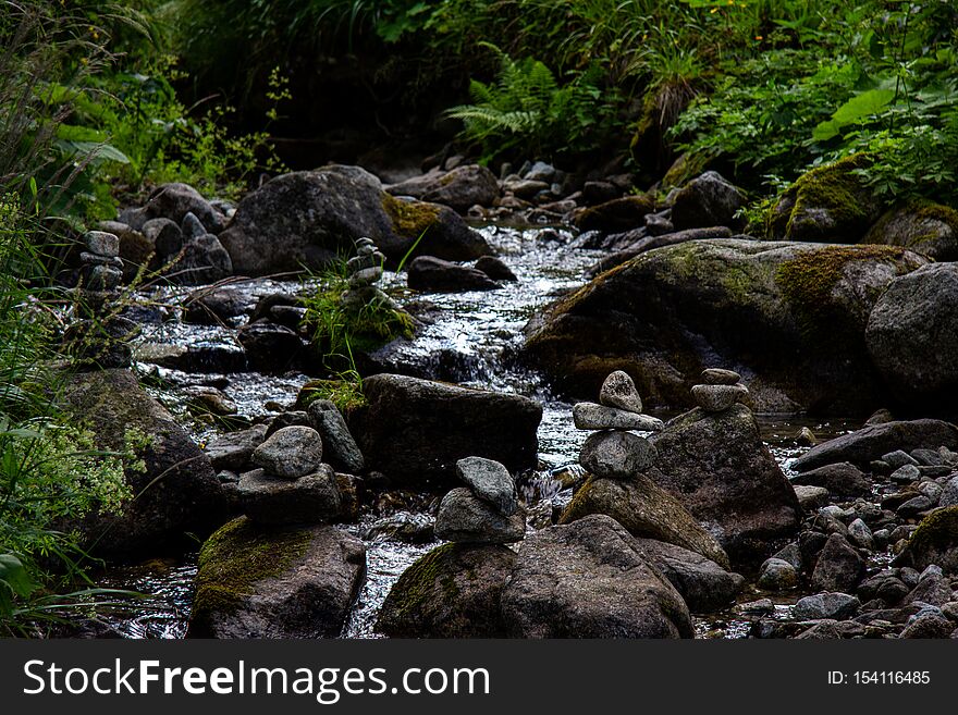 Stone Towers In A Stream