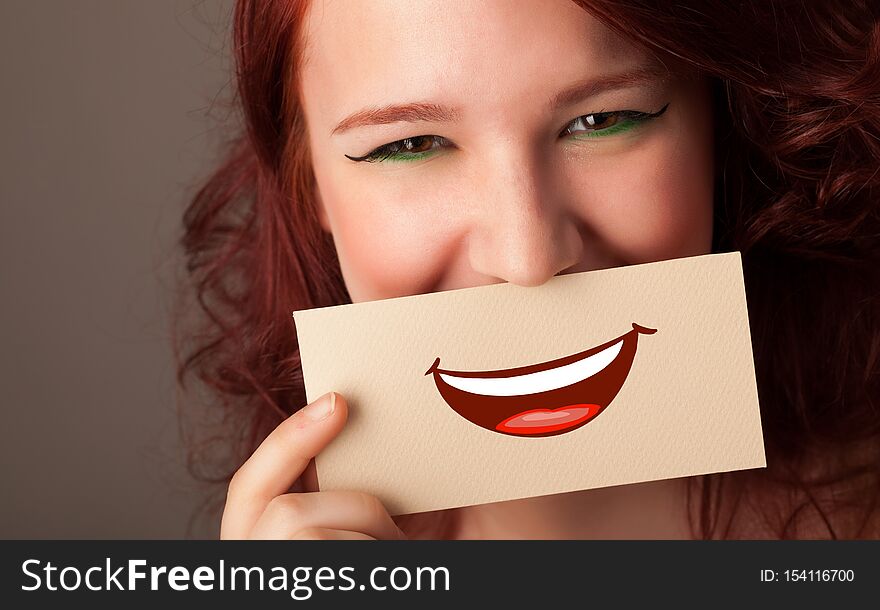 Person holding card in front of his mouth