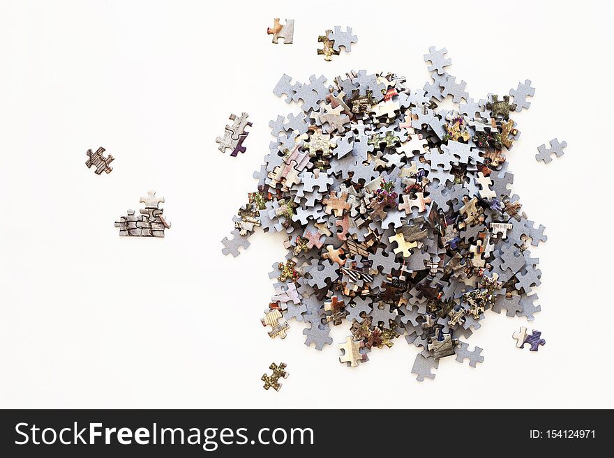 Unfinished color puzzle pieces on white background. Business concept