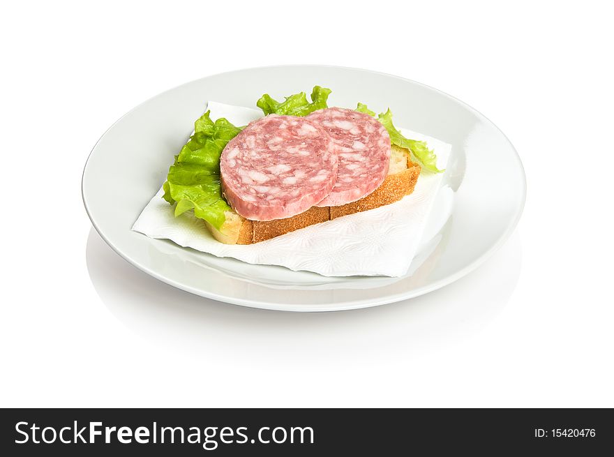 Open sandwich with two pieces of bloated sausage and lettuce