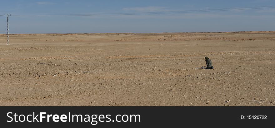 Man pray in desert