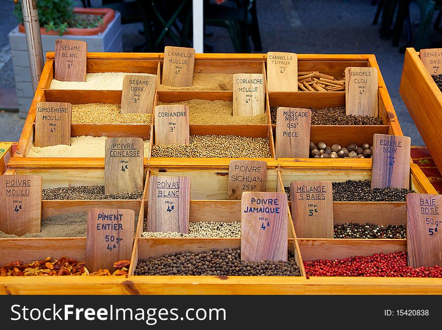 Colourful spices in wooden boxes with signs. Colourful spices in wooden boxes with signs