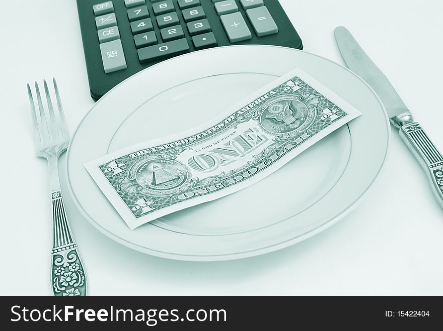 Dinner service with dollar denominations on plate and calculator buttons on backgrounds. Dinner service with dollar denominations on plate and calculator buttons on backgrounds