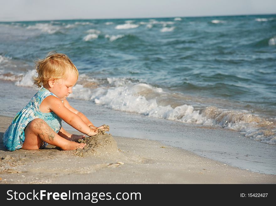 Cute girl playing on beach. Cute girl playing on beach