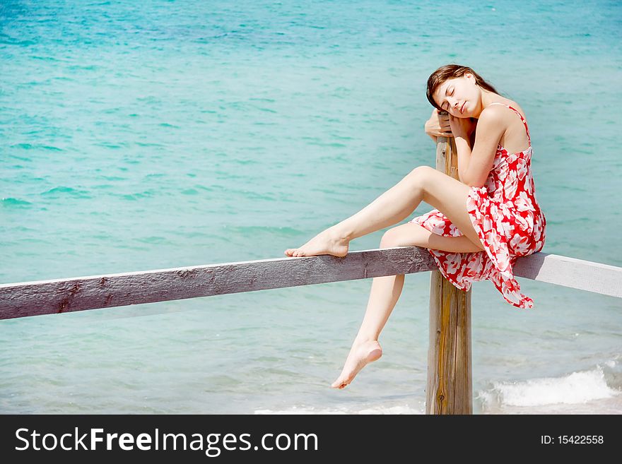 Dreaming girl on sea background