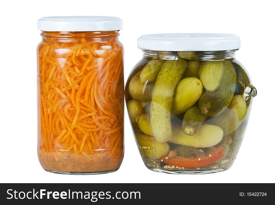 Banks pickled cucumbers and carrots on a white background