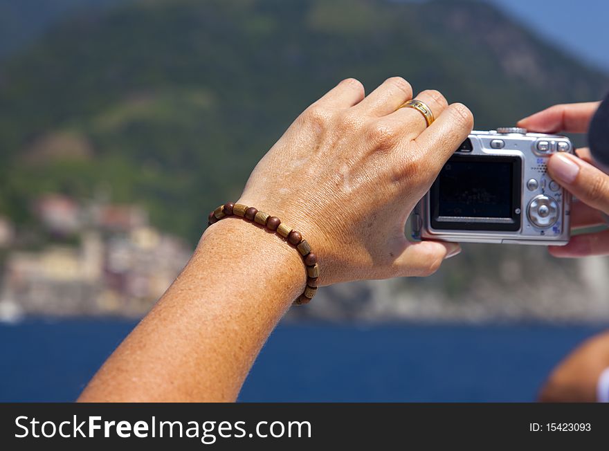 Woman taking picture of the mountains