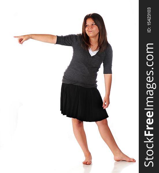 Full-length portrait of a silly young teen pointing into the distance. Isolated on white. Full-length portrait of a silly young teen pointing into the distance. Isolated on white.