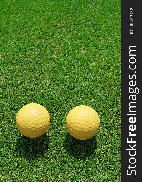 Two ceramic golf ball on green grass