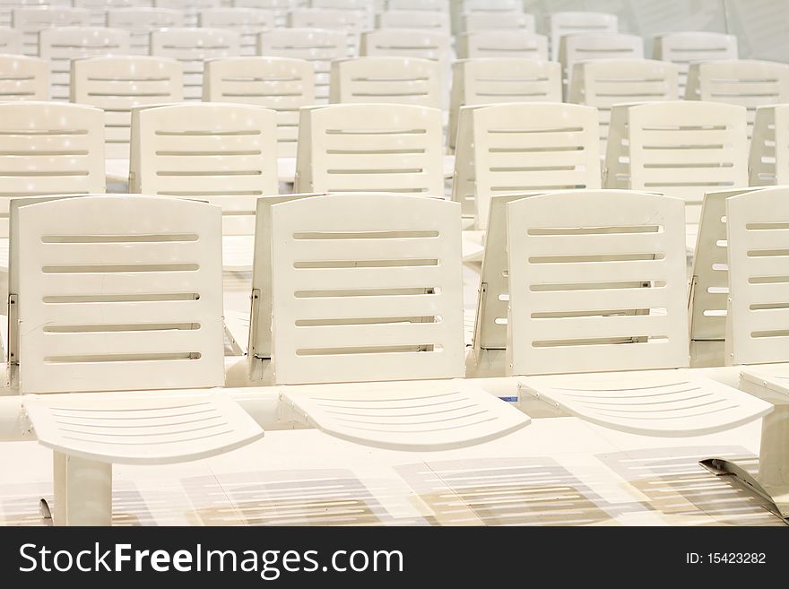A line of white chairs