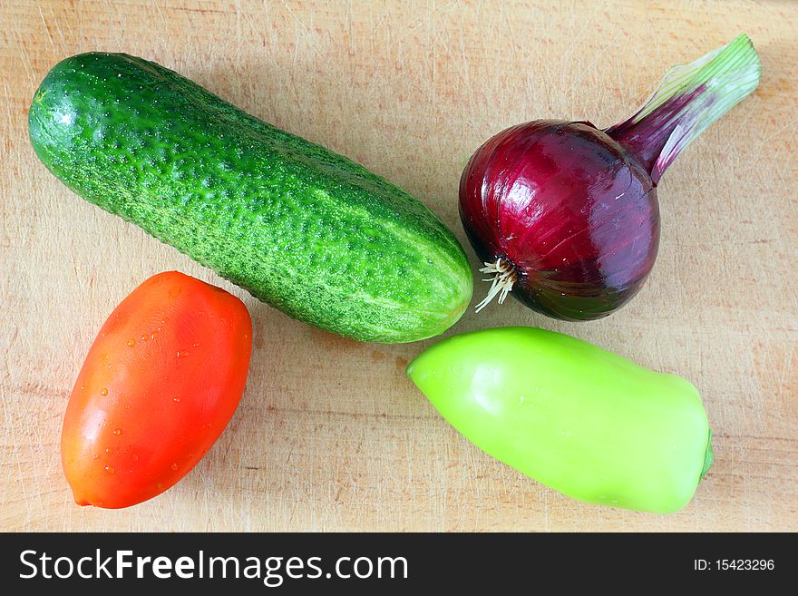 Fresh raw vegetables on a cutting board. Fresh raw vegetables on a cutting board