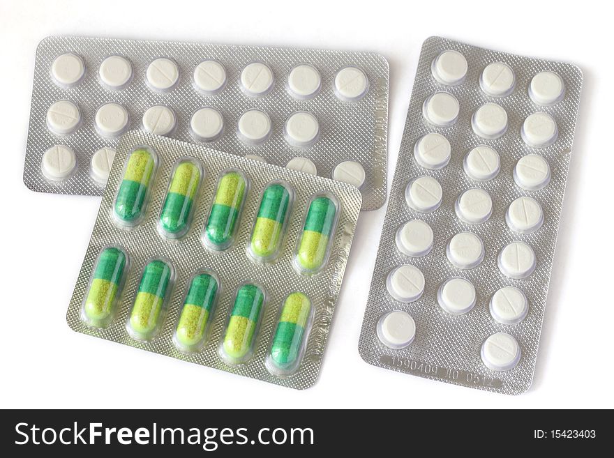 Tablets in a package on a white background