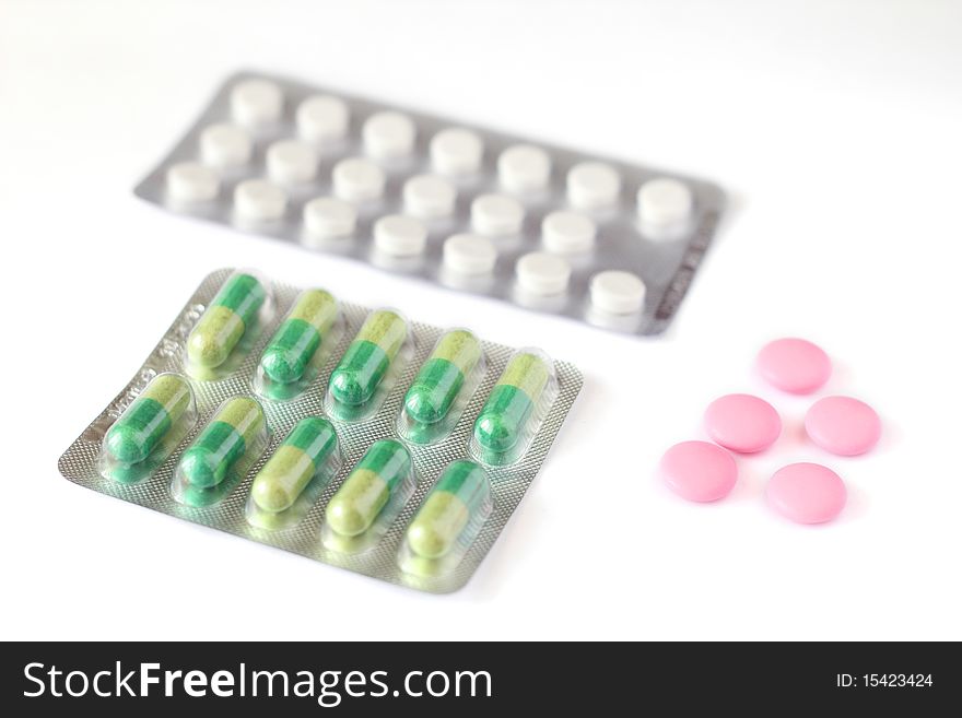 Tablets in a package on a white background