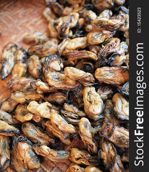 Chinese style sun dried oysters on a bamboo tray