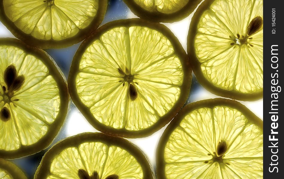 Some lemon slices on the glass surface. Some lemon slices on the glass surface