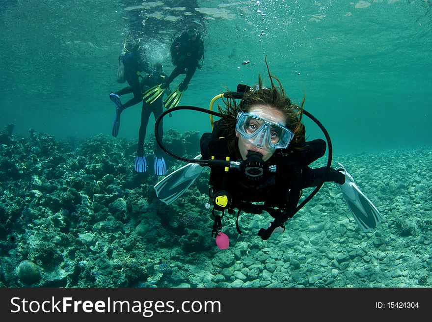 Female scuba diver starts to dive