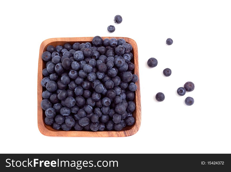 Bowl of blueberries on white background