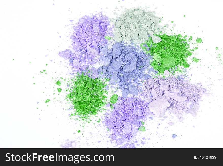 Colour crumbled eyeshadows, closed-up isolated on white. Colour crumbled eyeshadows, closed-up isolated on white