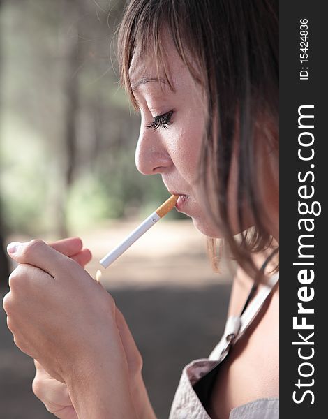Portrait Woman Lighting A Cigarette