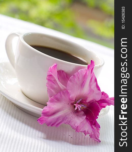 Cup of coffee with flower