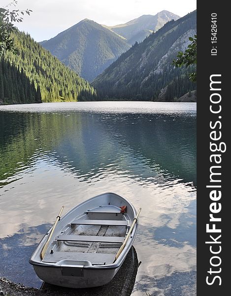 Peaceful mountainscape with boat