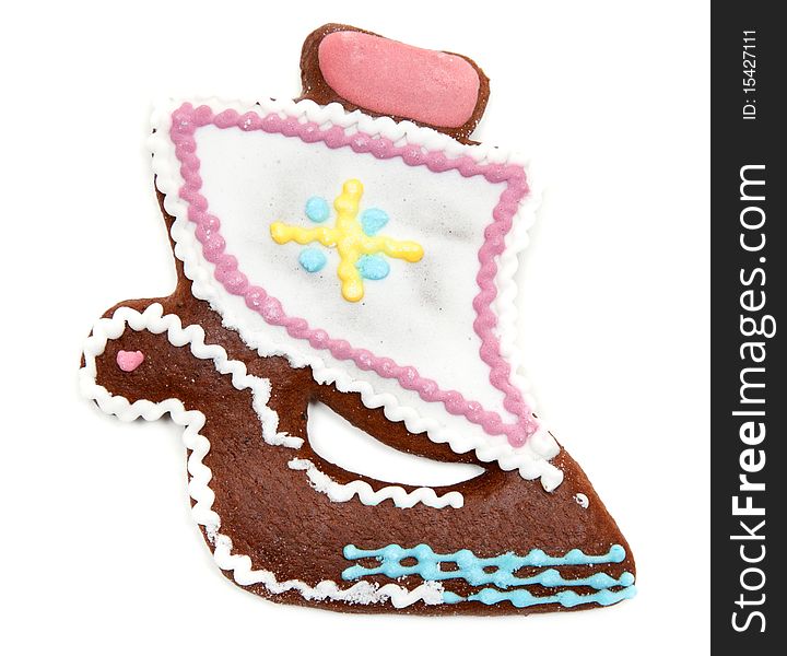 Gingerbread in form decorated by glaze sailfish on white background