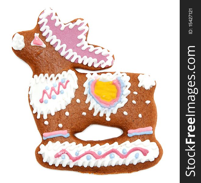 Gingerbread in form decorated by glaze of the deer on white background